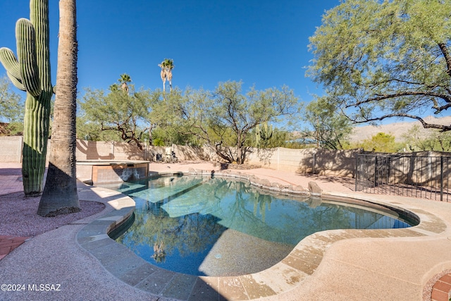 view of pool featuring a patio area