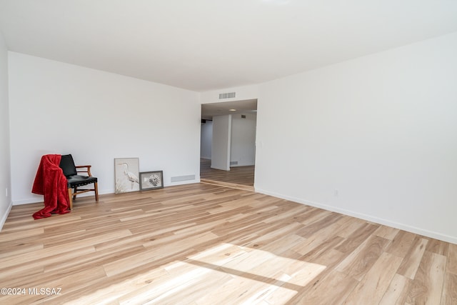 unfurnished room featuring light wood-type flooring