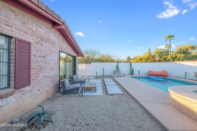 view of swimming pool featuring a patio area, a fenced in pool, and a fenced backyard