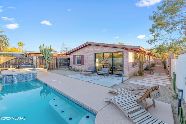 view of pool with a fenced in pool, a patio, an in ground hot tub, and a fenced backyard