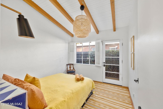 bedroom with vaulted ceiling with beams