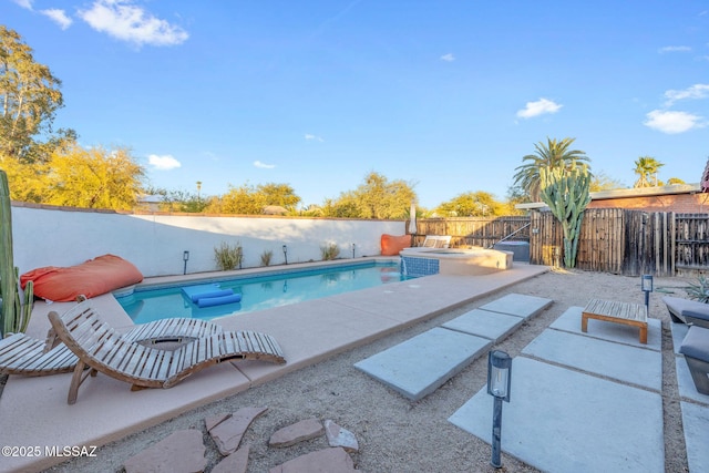 view of swimming pool featuring a patio area, a fenced in pool, and a fenced backyard