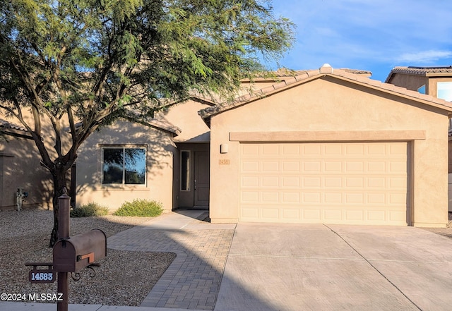 view of front of home with a garage