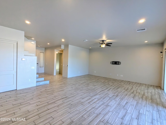 empty room featuring light hardwood / wood-style flooring and ceiling fan