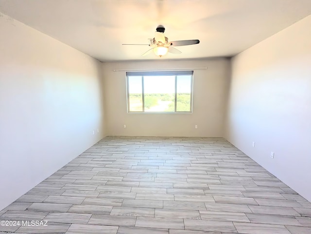 unfurnished room with light hardwood / wood-style floors and ceiling fan