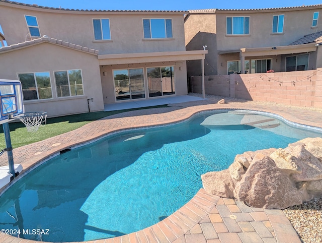 view of swimming pool featuring a patio