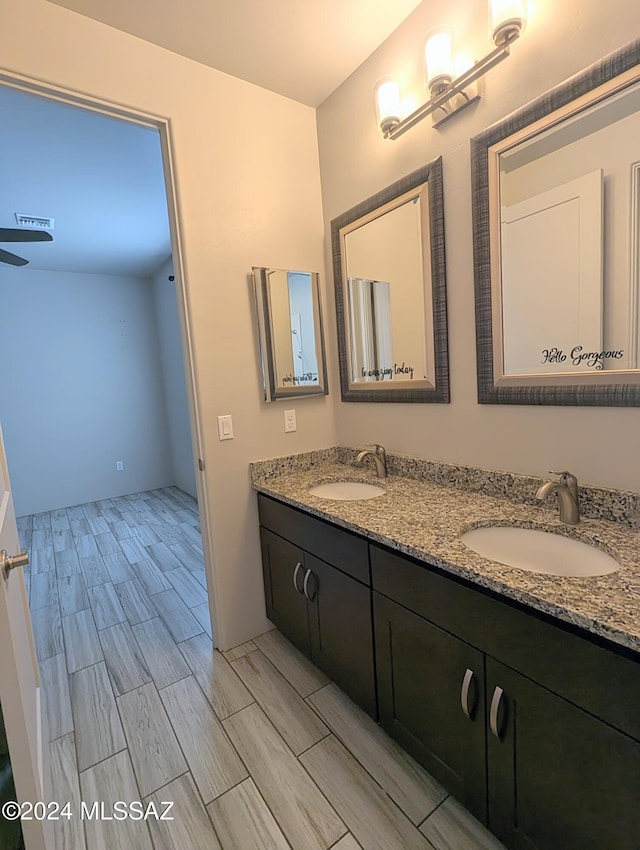 bathroom featuring vanity and ceiling fan