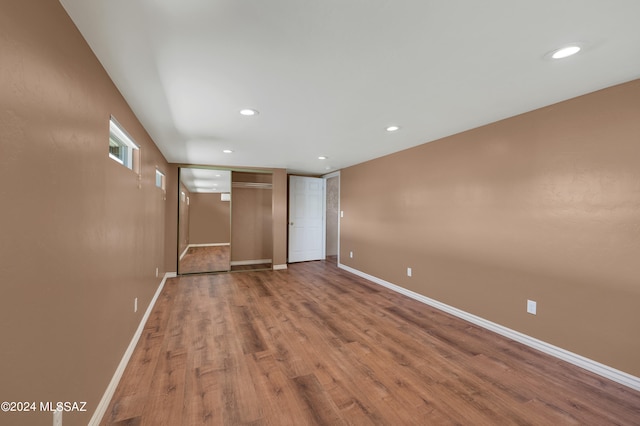 interior space featuring hardwood / wood-style flooring and a closet