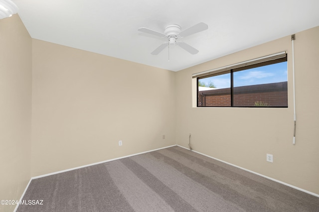 empty room with ceiling fan and carpet floors