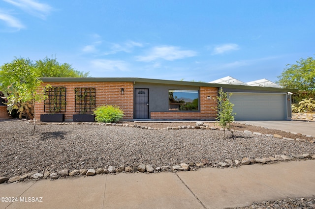 single story home with a garage