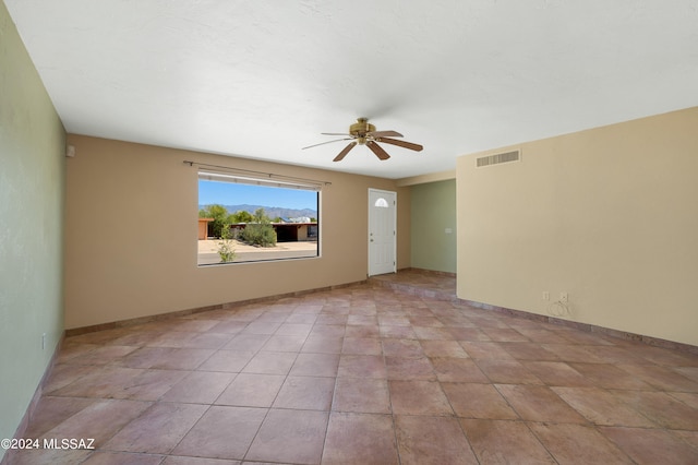 unfurnished room with ceiling fan