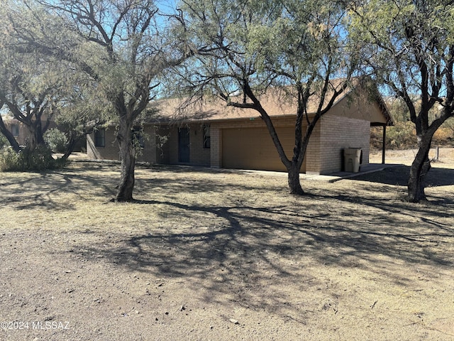 single story home with a garage