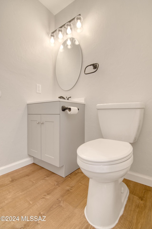 bathroom featuring toilet and wood-type flooring