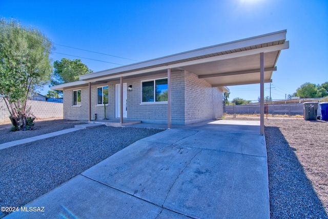 ranch-style home with a carport