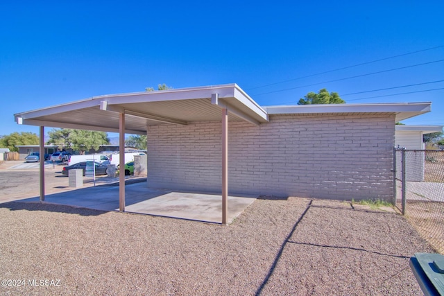 exterior space with a carport