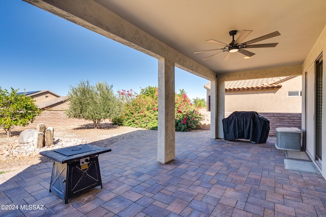 view of patio featuring area for grilling and ceiling fan