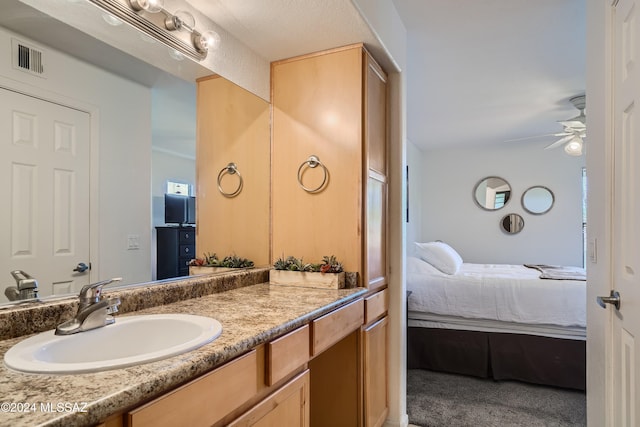 bathroom featuring vanity and ceiling fan