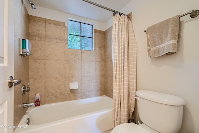 bathroom with toilet and shower / bath combo