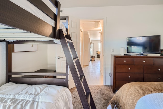 bedroom with wood-type flooring