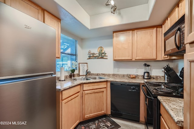 kitchen featuring black appliances, sink, and light brown cabinetry