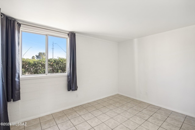 spare room featuring light tile patterned floors