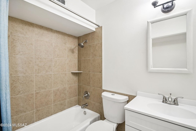 full bathroom featuring vanity, shower / bath combination with curtain, and toilet