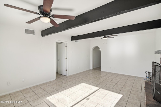 unfurnished living room featuring beam ceiling, light tile patterned floors, and ceiling fan