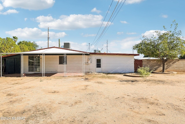 rear view of house with central AC