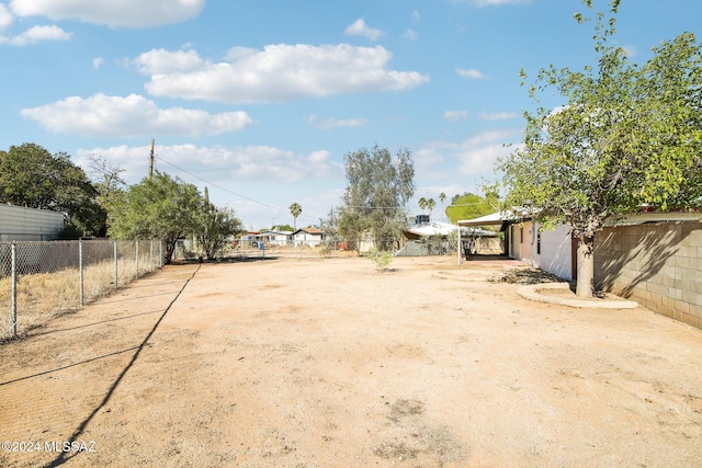 view of yard with a carport