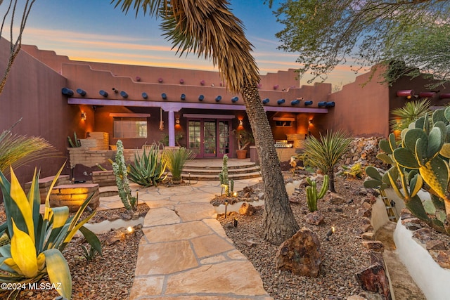 patio terrace at dusk with french doors