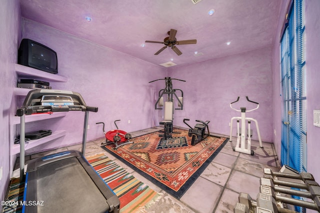 exercise room with ceiling fan