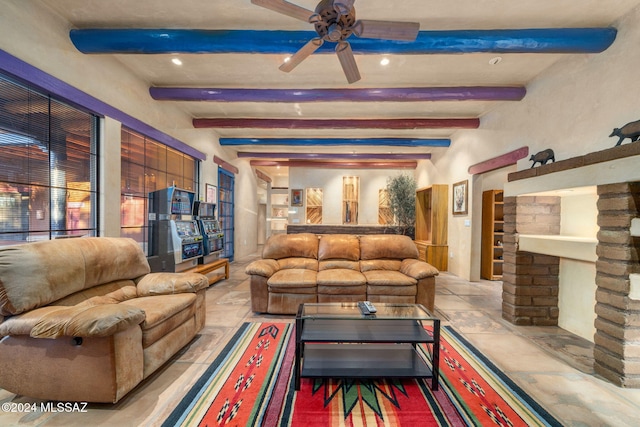 living room with beamed ceiling and ceiling fan