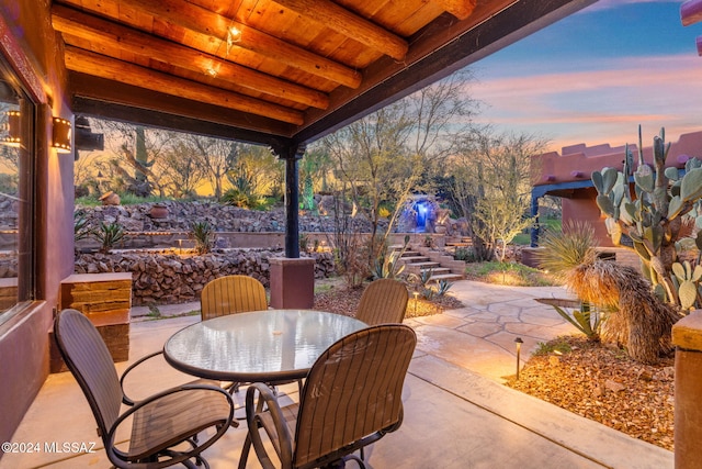 view of patio terrace at dusk