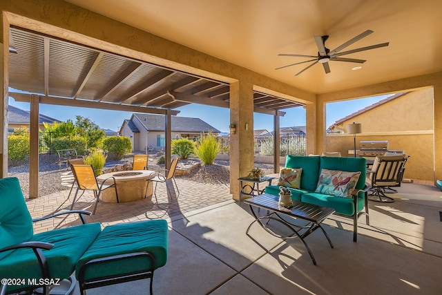 view of patio featuring an outdoor living space with a fire pit and ceiling fan