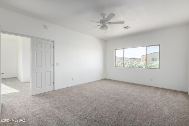 carpeted empty room with ceiling fan