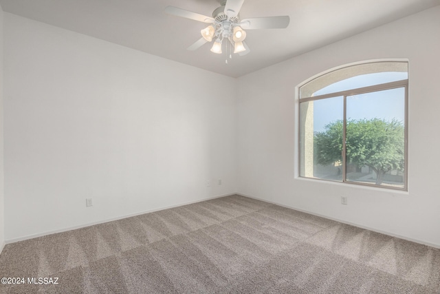 empty room featuring carpet and ceiling fan