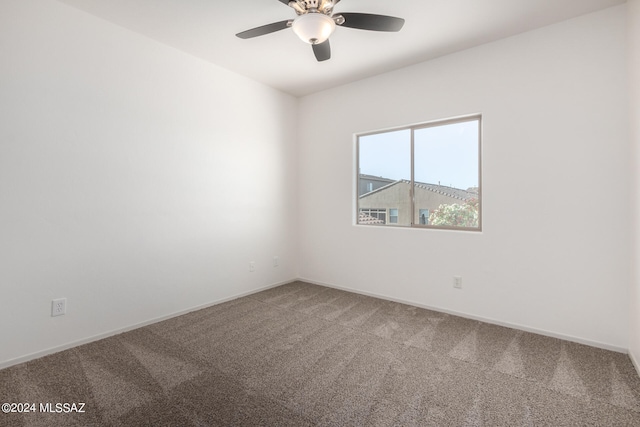 empty room with ceiling fan and carpet floors