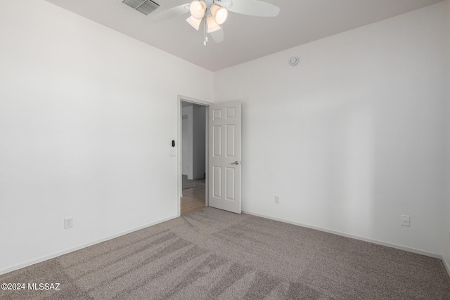 carpeted empty room with ceiling fan