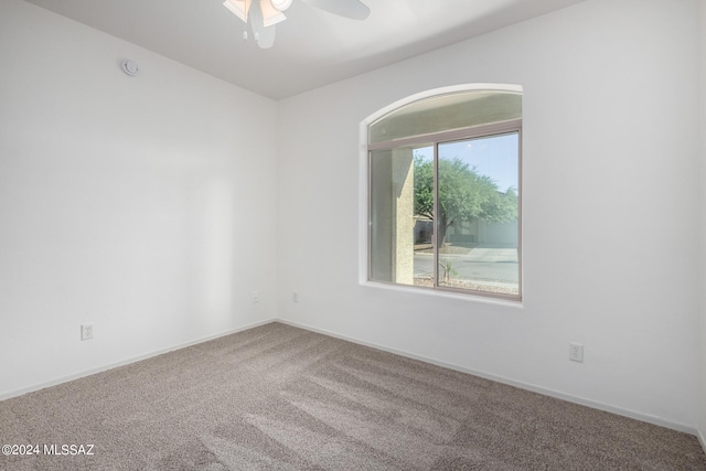 carpeted empty room with ceiling fan