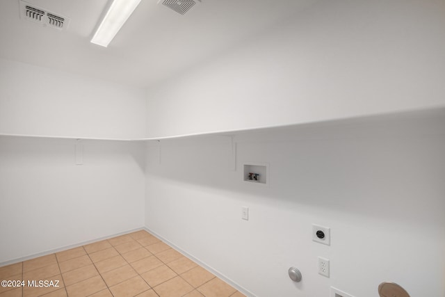 laundry area featuring hookup for an electric dryer, gas dryer hookup, hookup for a washing machine, and light tile patterned floors