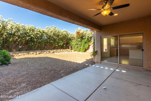 view of patio featuring ceiling fan