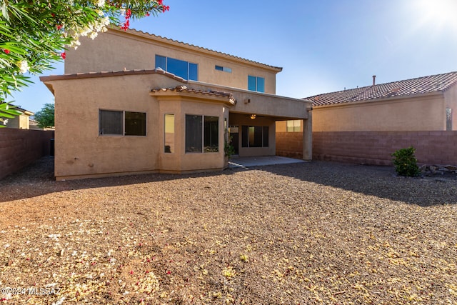 back of property with a patio area