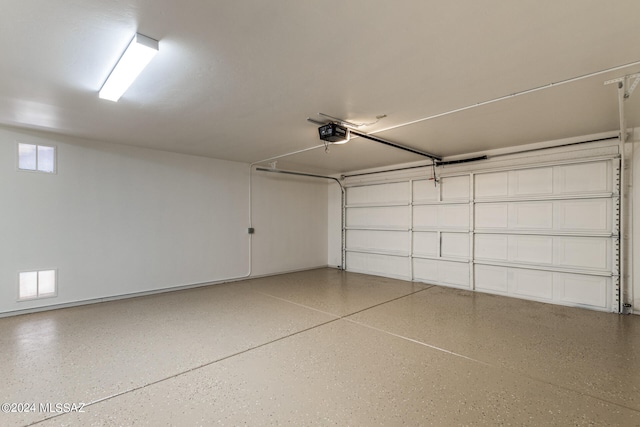 garage featuring a garage door opener