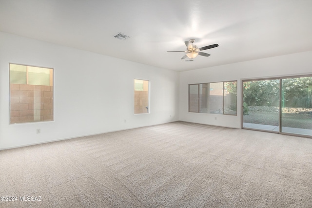 empty room with carpet and ceiling fan