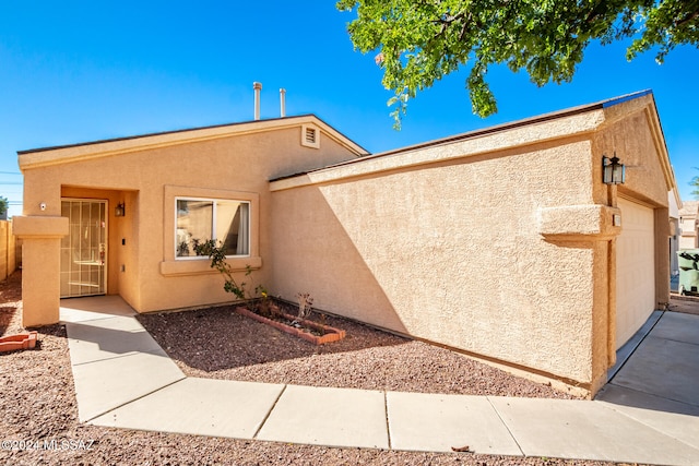 exterior space with a garage