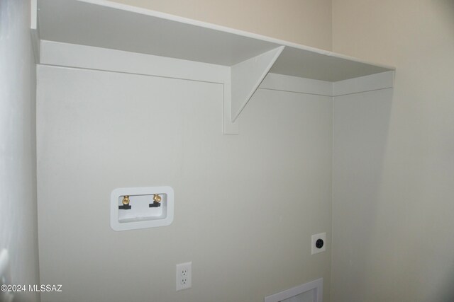 laundry area with hookup for an electric dryer and washer hookup