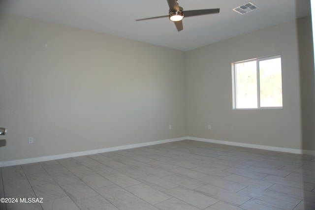 spare room featuring ceiling fan