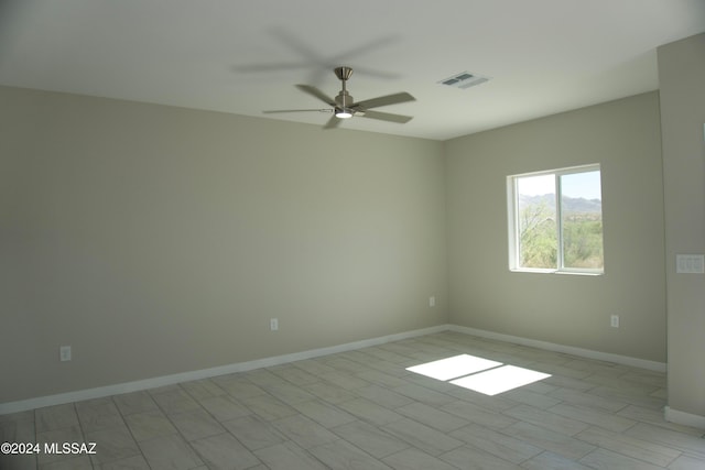 spare room with ceiling fan