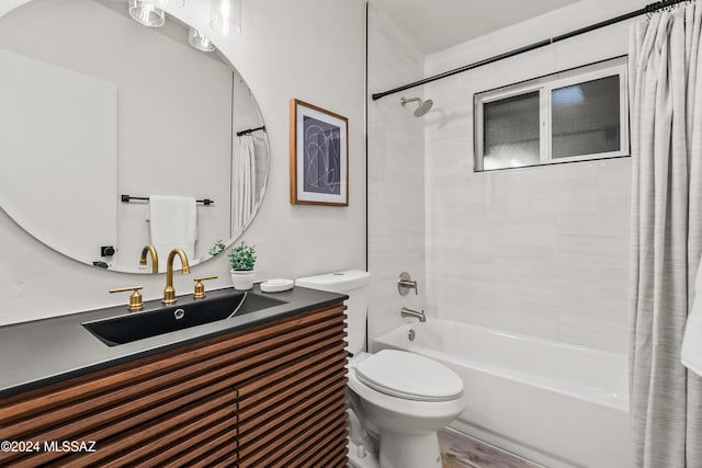 full bathroom featuring shower / bath combo, vanity, and toilet