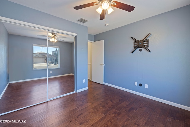 unfurnished bedroom with a closet, hardwood / wood-style flooring, and ceiling fan